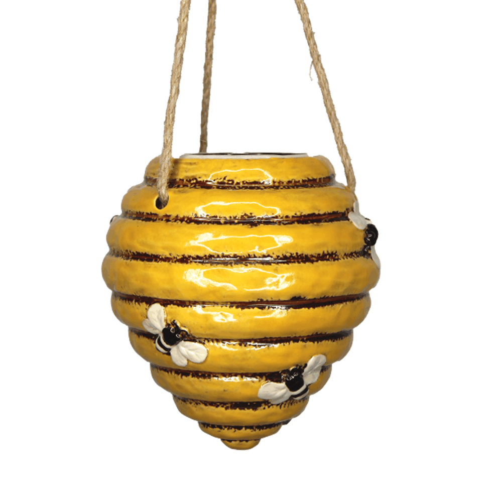 Honey Hive Hanging ceramic planter in glossy honey-yellow with dark brown bands, raised hive ridges, bee accents, and rope hanger.