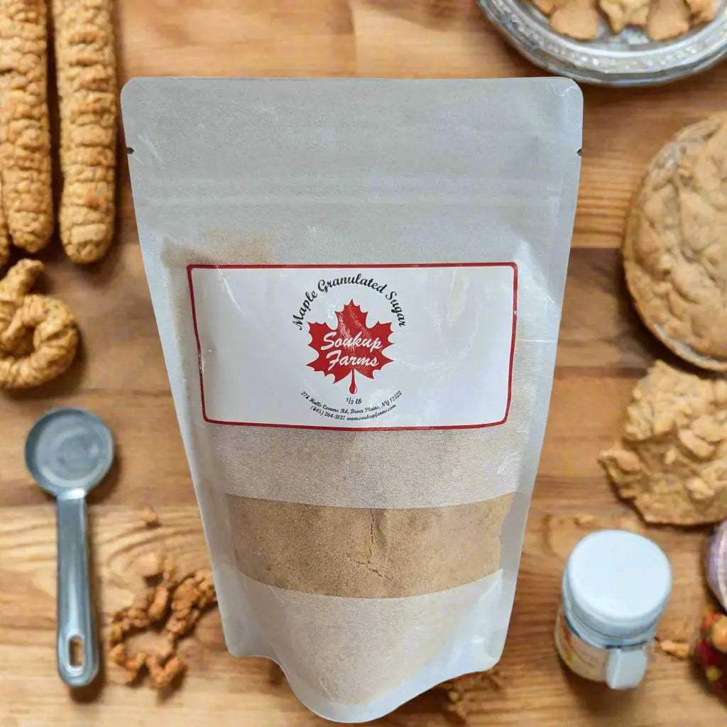 Granulated maple sugar in a resealable clear pouch with a white and red Soukup Farms label, NY MAPLE PRODUCTS BY SOUKUP FARMS