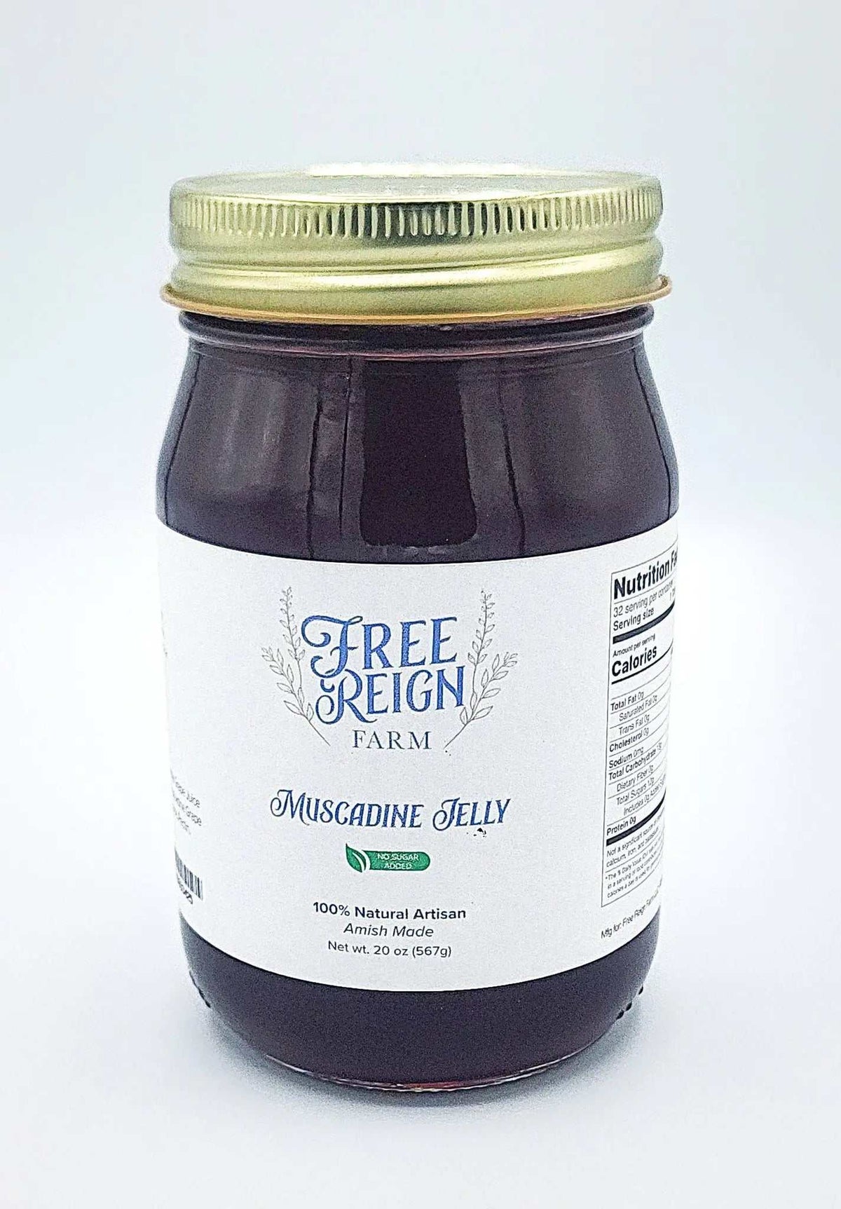 Amish Made Jam muscadine jelly in a clear glass jar, with deep purple contents, a gold lid, and a white label.