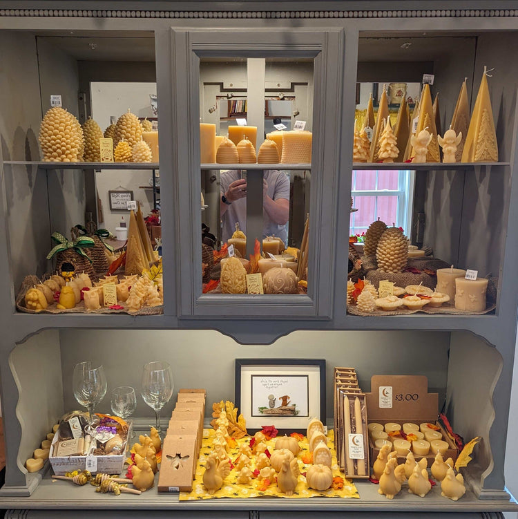 100% Beeswax Candles in golden yellow, molded into assorted seasonal shapes, tapers and votives with a natural wax finish