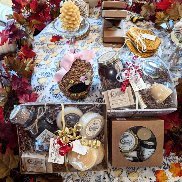 Gifts featuring hand-assembled boxes of candles, soaps and bath treats with ribbons, tags and seasonal leaf accents