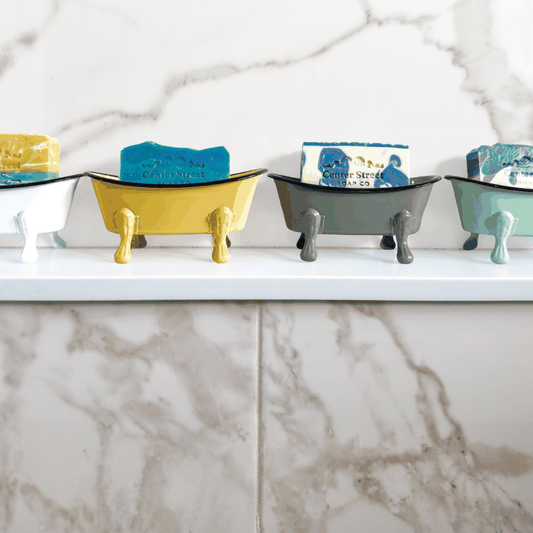 Antique Bathtub Soap Dish in yellow, gray, mint, and white metal, with a black rim and miniature clawfoot legs.