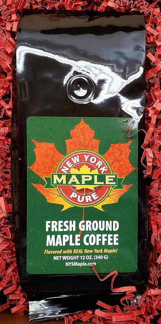 Maple Coffee ground coffee in a glossy black pouch with a green maple leaf label and New York maple branding