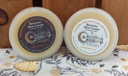 SKIN CREAM in two round, clear-lidded tubs with pale cream balm and circular beeswax labels in brown and cream tones